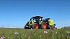 Claas Arion 6.190 med rundballepresse bak