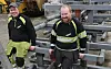 Elias Moan (t. v.) og Kristian Ugedal smiler iført verneklær